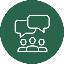 White icon of three people with two overlapping speech bubbles above their heads, set against a dark green circular background, representing communication or group discussion.